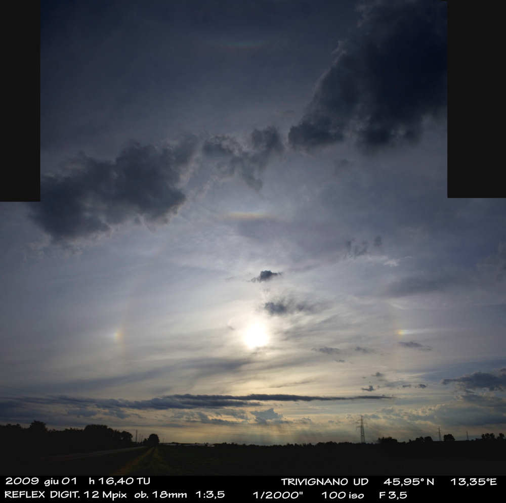 Atmospheric display with sundogs and arcs: 55 KB; click on the image to enlarge
