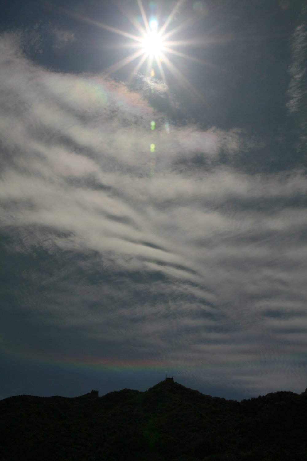 Circumhorizon arc with nacreous clouds over Chinese Great Wall: 99 KB; click on the image to enlarge to 1000x1500 pixel