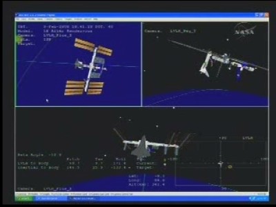 Il grafico della sala controllo mostra lo space shuttle Atlantis attraccato alla Stazione Spaziale Internazionale: 24 KB