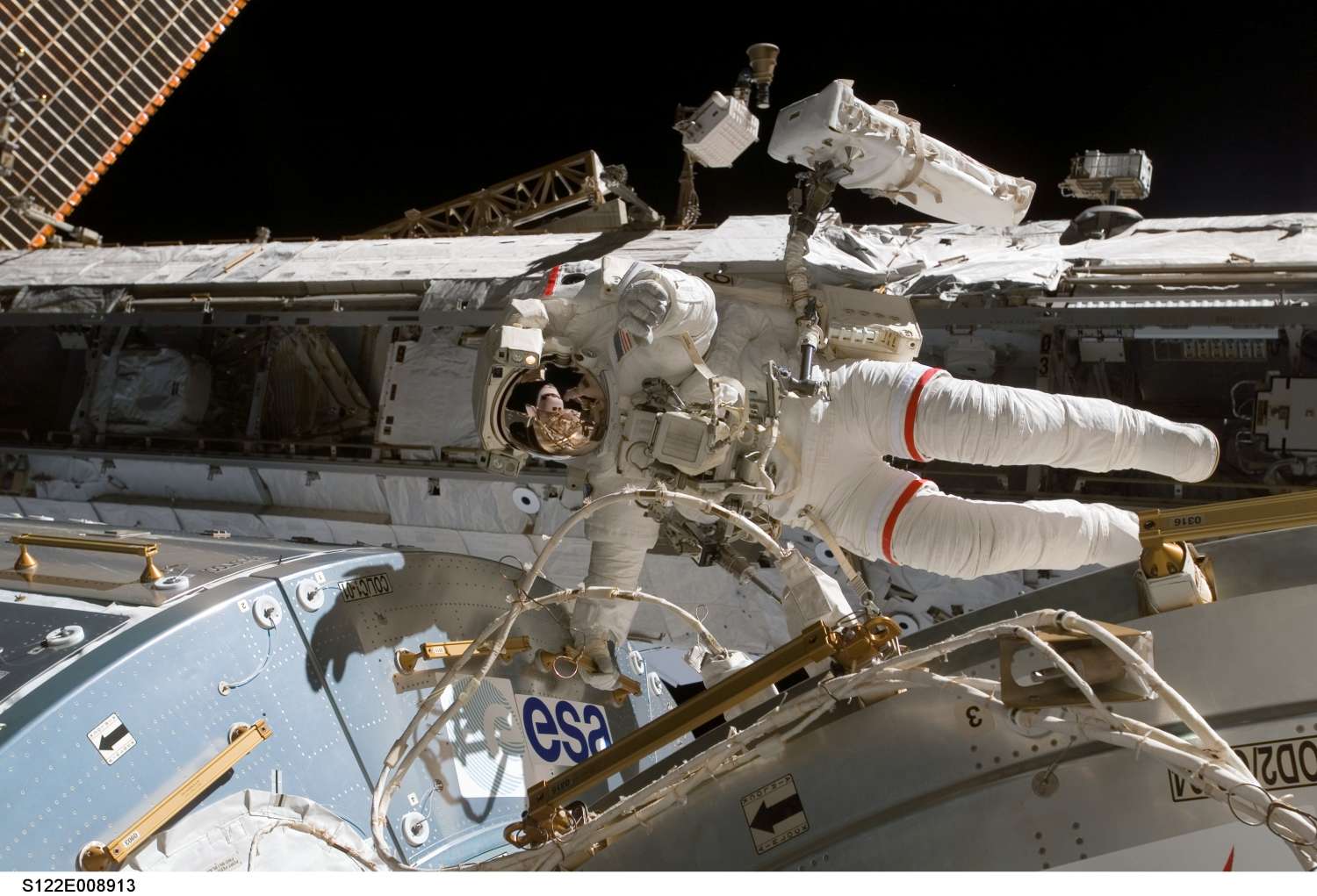 NASA astronaut Rex Walheim over Columbus laboratory: 153 KB