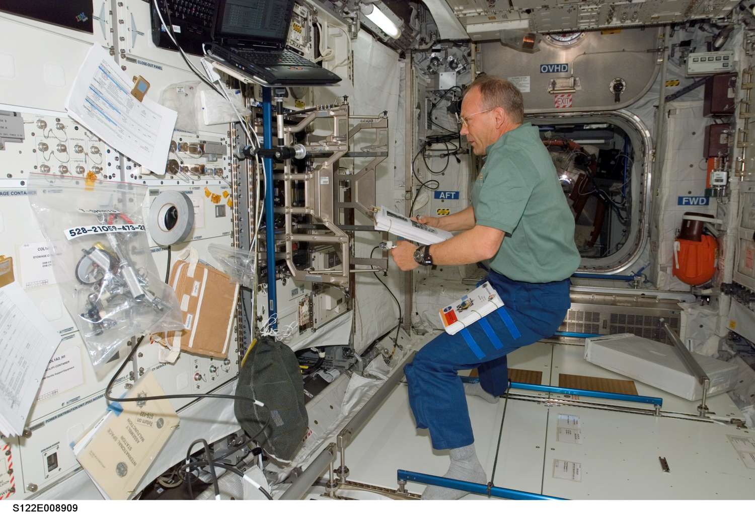 ESA astronaut Hans Schlegel works in Columbus laboratory: 177 KB